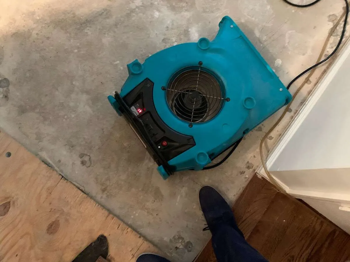 Air mover drying subfloor during Leak Detection & Repair in Pimmit Hills